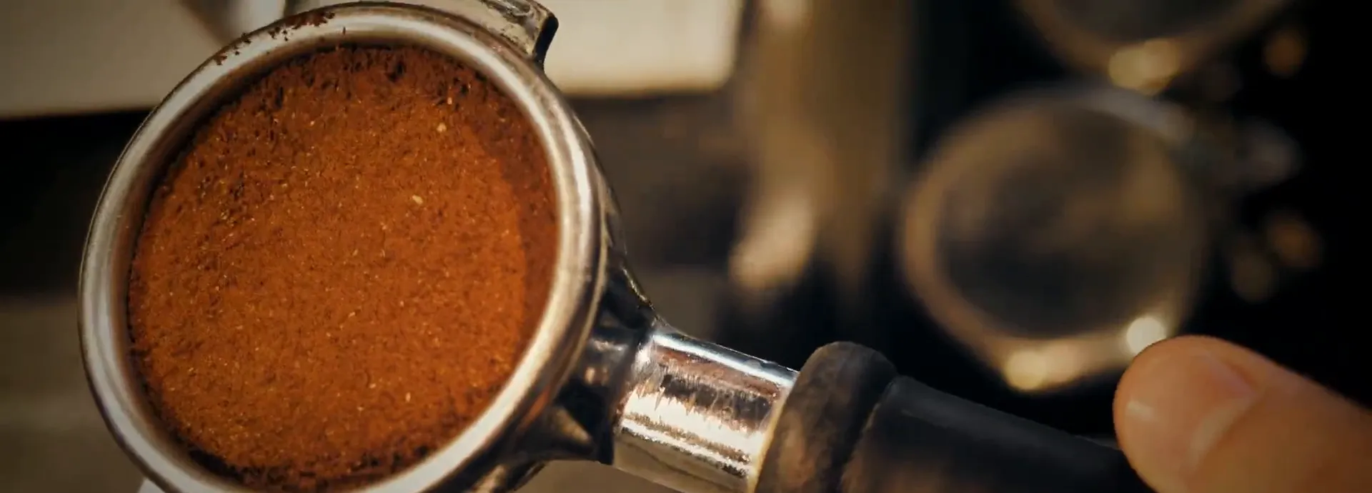 A portafilter filled with freshly ground coffee